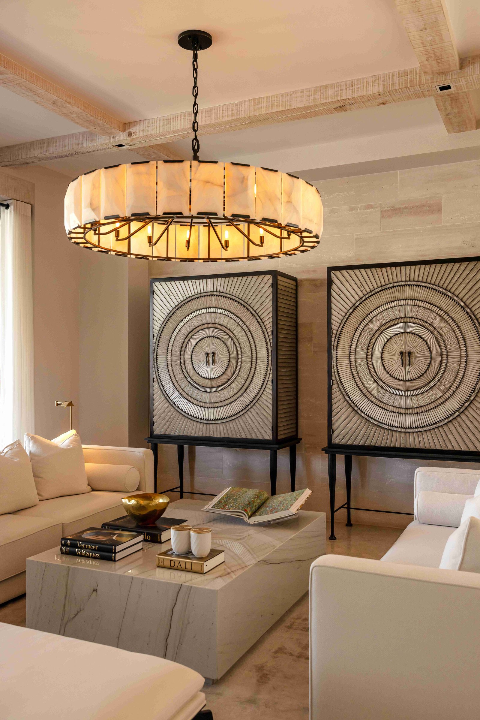 Living room with decorative circular art cabinets and marble coffee table
