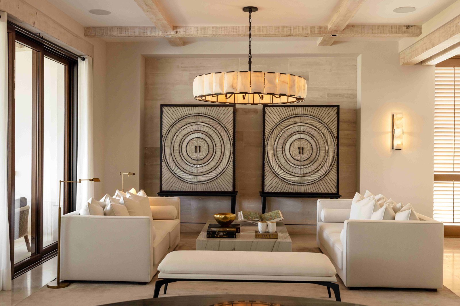 Elegant sitting room with alabaster chandelier and circular art panels